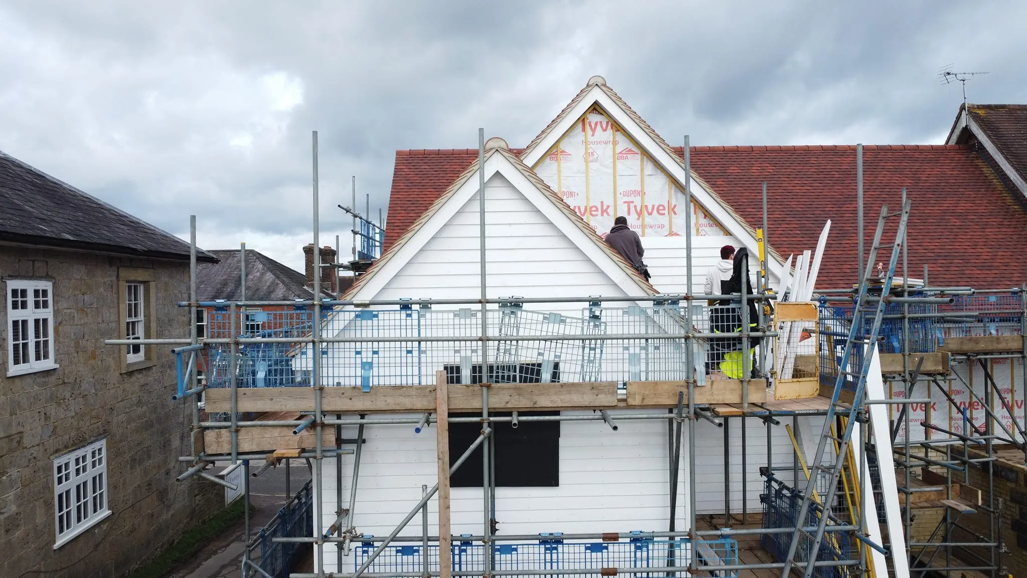 A house being built with scaffolding around it.